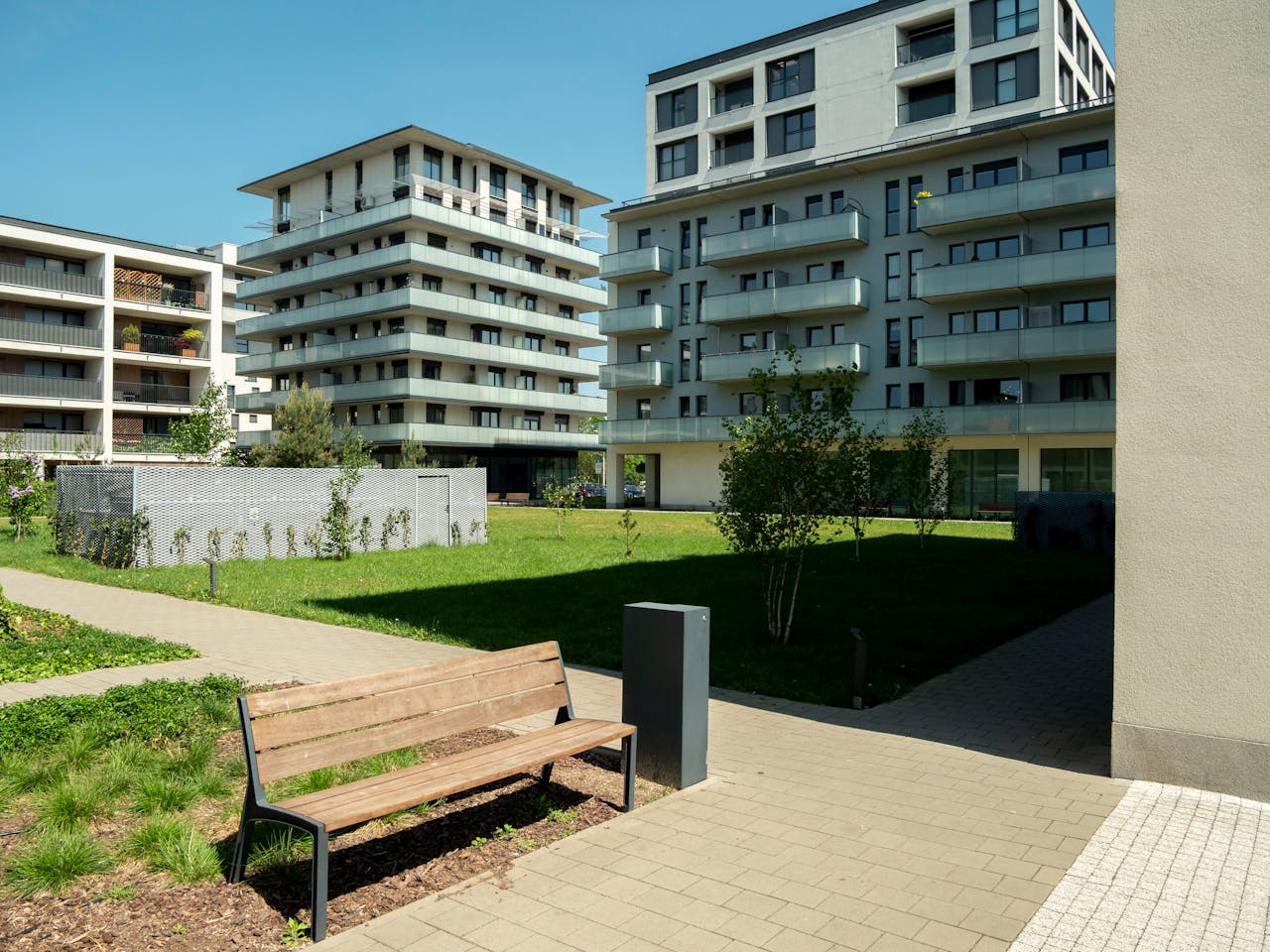 our-stories Contemporary apartment buildings with green spaces in Wrocław, Poland.